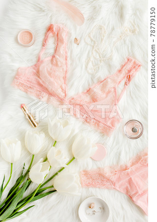 Flat lay set of sexy, lacy, pink lingerie, accessories on white background. Top view. Flat lay set of sexy, lacy, pink lingerie, accessories on white background. Top view. 78779150