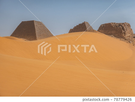 Pyramids behind a large sand dune in the desert of Sudan Pyramids behind a large sand dune in the desert of Sudan 78779426