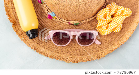 Summer lady straw hat, yellow sun protection spray and sunglasses on turquoise stone background. Summer lady straw hat, yellow sun protection spray and sunglasses on turquoise stone background. 78780967