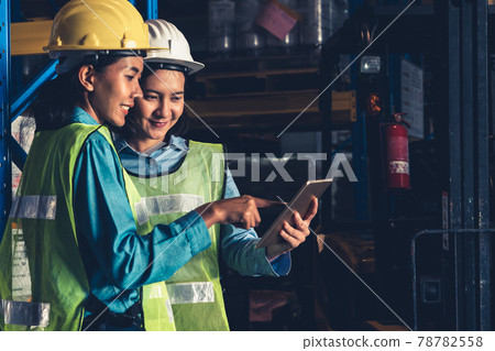 Female warehouse worker working at the storehouse Female warehouse worker working at the storehouse 78782558