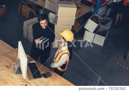 Warehouse manager and worker working in the storehouse Warehouse manager and worker working in the storehouse 78782562
