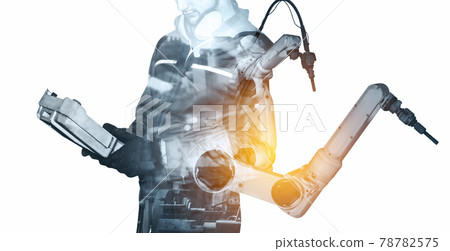 Mechanized industry robot arm and factory worker double exposure 78782575