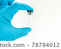 Glass bottle for vaccines on white background 78784012