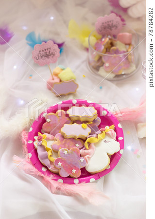 Birthday cookies - detail of a dessert table - colorful cookies with pink 'Happy Birthday' topper 78784282