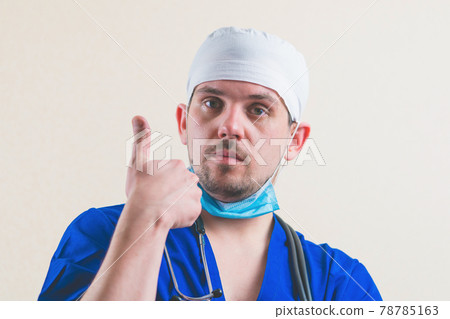 Young doctor portrait with thumb up Young doctor portrait with thumb up 78785163