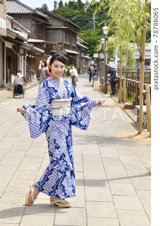 The streets of Little Edo Sawara and a young woman in a beautiful yukata The streets of Little Edo Sawara and a young woman in a beautiful yukata 78786065