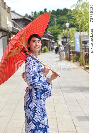 The streets of Little Edo Sawara and a young woman in a beautiful yukata The streets of Little Edo Sawara and a young woman in a beautiful yukata 78786126