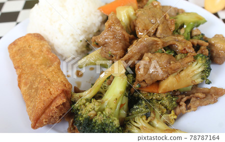 Beef Broccoli and Egg Roll on Plate in Chinese Restaurant 78787164