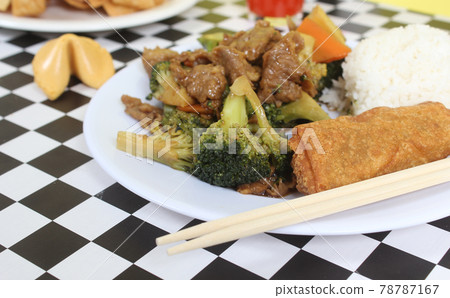Beef Broccoli and Egg Roll on Plate in Chinese Restaurant 78787167
