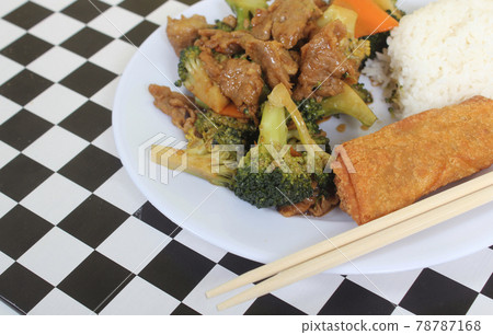 Beef Broccoli and Egg Roll on Plate in Chinese Restaurant 78787168