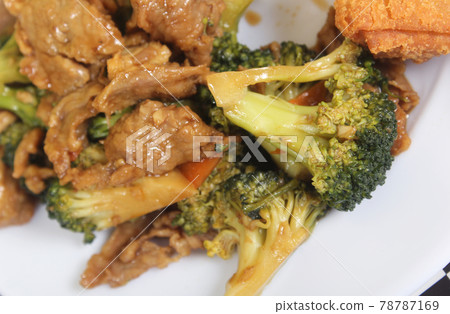 Beef Broccoli and Egg Roll on Plate in Chinese Restaurant 78787169
