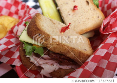 Club Sandwich on Gluten Free Bread in Retro Diner Cafe 78787281