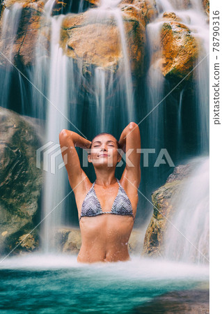 Waterfall sexy woman relaxing in tropical natural water happy in rainforest pool on travel, Bikini girl in pristine nature enjoying summer travel vacation Waterfall sexy woman relaxing in tropical natural water happy in rainforest pool on travel, Bikini girl in pristine nature enjoying summer travel vacation 78790316