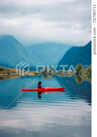 Adventure Caucasian Adult Woman Kayaking in Red Kayak 78790713