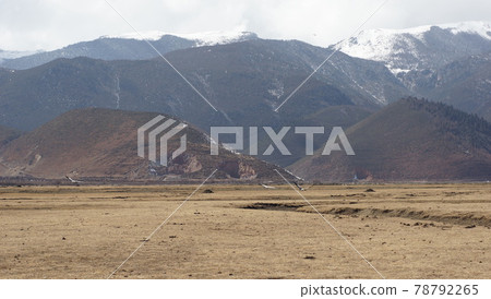 Native herdsman travel in the grassland at Shangri La, or Shangri-la, Yunnan province, China Native herdsman travel in the grassland at Shangri La, or Shangri-la, Yunnan province, China 78792265