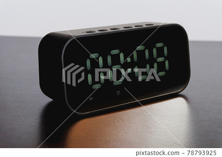 Black Digital alarm clock on background. Black Digital alarm clock on background. 78793925