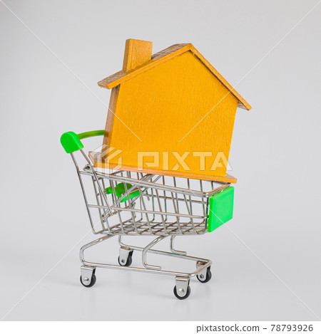 Golden house with shopping cart trolley ,Housing and Real Estate concept. 78793926