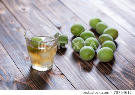 Homemade plum wine and ome poured into a glass 78794612