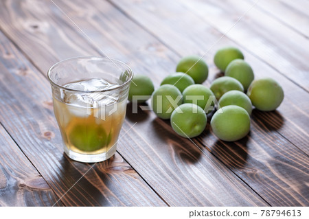 Homemade plum wine and ome poured into a glass 78794613