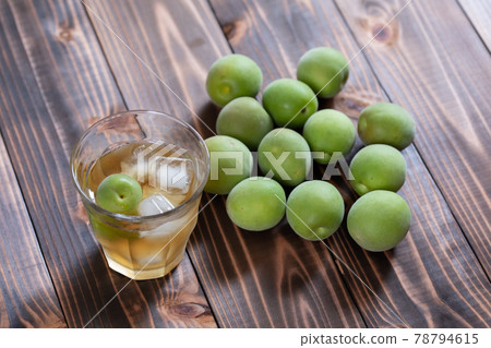 Homemade plum wine and ome poured into a glass 78794615