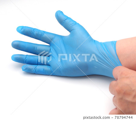 Men's hands wearing nitrile gloves 78794744