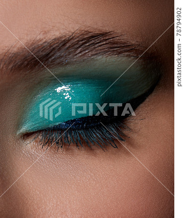 young woman with blue eye shadow makeup 78794902