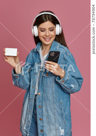 happy beautiful woman in headphones listening to music 78794904