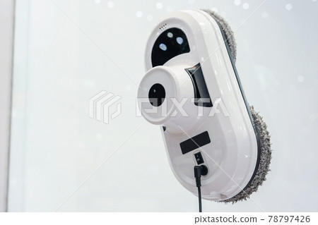 Domestic robot cleaning glass window on high rise building. Personal robot housekeeping futuristic concept Domestic robot cleaning glass window on high rise building. Personal robot housekeeping futuristic concept 78797426