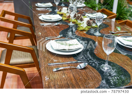 modern ceramic tableware in dining room with table set ready for a nice meal modern ceramic tableware in dining room with table set ready for a nice meal 78797430