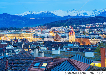Aerial view of the red tiled roofs of the old town of Lucerne city, wooden Chapel bridge, Reuss river and Lake Lucerne from city wall, Switzerland Aerial view of the red tiled roofs of the old town of Lucerne city, wooden Chapel bridge, Reuss river and Lake Lucerne from city wall, Switzerland 78797434