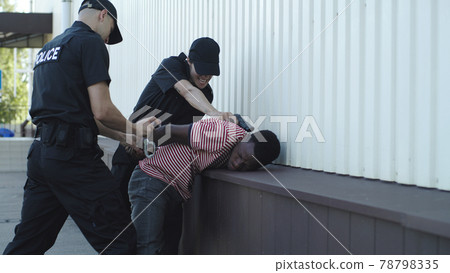 Police officers arresting black man 78798335