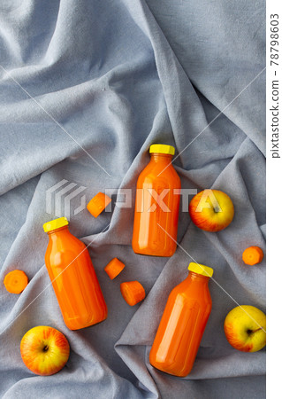 Carrot apple juice in bottles 78798603