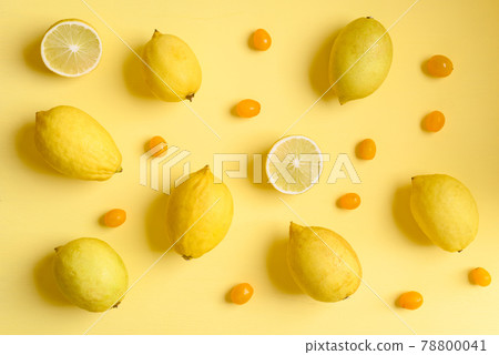 Fresh lemon and tomato on yellow color background, Flat lay, Top view Fresh lemon and tomato on yellow color background, Flat lay, Top view 78800041