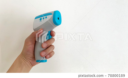 Non-contact thermometer held in the left hand Non-contact thermometer held in the left hand 78800189