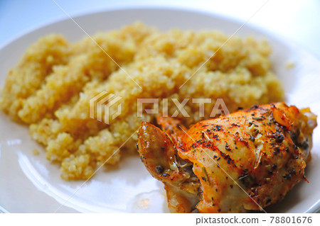 A piece of baked chicken with porridge on a light plate. A light and healthy lunch. Healthy eating. A piece of baked chicken with porridge on a light plate. A light and healthy lunch. Healthy eating. 78801676