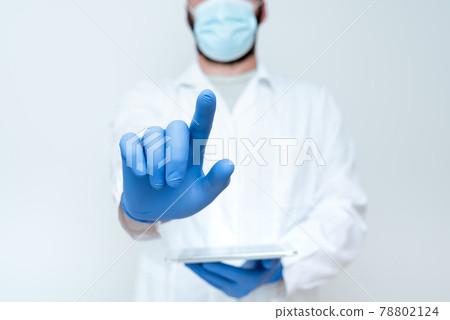 Demonstrating Medical Technology, Presenting New Scientific Discovery, Laboratory Presentations, Science Discussions, Wearing Occupation Workwear Protective Gears Demonstrating Medical Technology, Presenting New Scientific Discovery, Laboratory Presentations, Science Discussions, Wearing Occupation Workwear Protective Gears 78802124