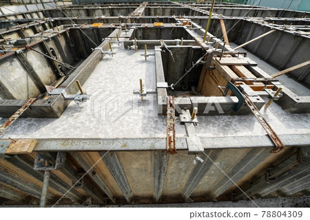 After placing concrete for foundation work at the construction site 78804309