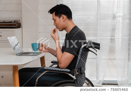 An Asian disabled man sits in a wheelchair is stressed and disappointed And taking medicine After having a car accident, The concept of negligence and the effects of drunk driving. An Asian disabled man sits in a wheelchair is stressed and disappointed And taking medicine After having a car accident, The concept of negligence and the effects of drunk driving. 78805468