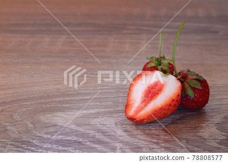 Real homemade strawberries from the garden on a wooden table Real homemade strawberries from the garden on a wooden table 78808577