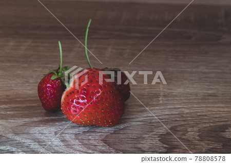 Homemade ripe strawberries on wooden background 78808578