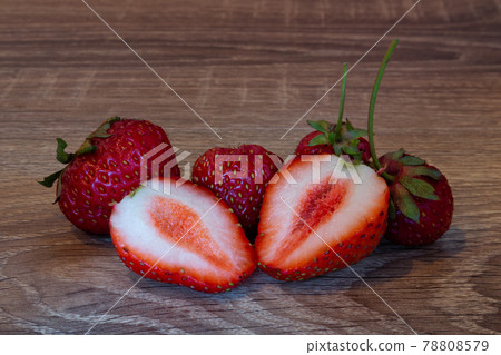 Fresh ripe strawberries from the garden on a wooden table Fresh ripe strawberries from the garden on a wooden table 78808579