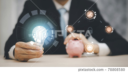 Businessman holds the light bulb technology and market icon on white background, Creativity, and innovation are keys to success,  new idea and innovation with Brain and light bulbs 78808580