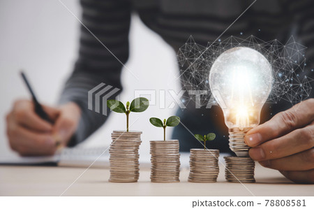 thinking and creative with Coins and light bulb concept,Close up light bulb and working on the desk, Creativity and innovation are keys to success.Concept of new idea and innovation with Brain. thinking and creative with Coins and light bulb concept,Close up light bulb and working on the desk, Creativity and innovation are keys to success.Concept of new idea and innovation with Brain. 78808581