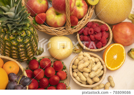Group Fruits mixed with banana, orange, strawberry and nuts, concept health food and diet, vegetarian food in the top view on the wood table. 78809086