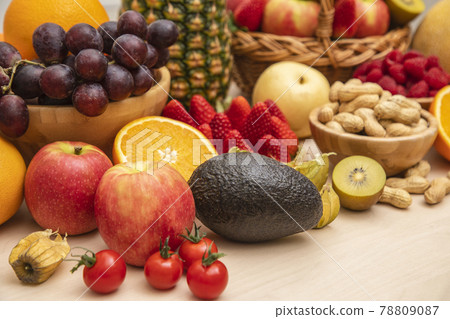 Group Fruits mixed with banana, orange, strawberry and nuts, concept health food and diet, vegetarian food in the top view on the wood table. 78809087