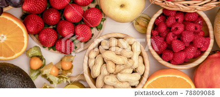 Group Fruits mixed with banana, orange, strawberry and nuts, concept health food and diet, vegetarian food in the top view on the wood table. 78809088