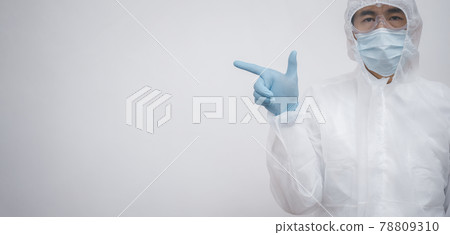 Asian doctor in protective PPE suit wearing face mask and eyeglasses and visor fighting against corona virus outbreak - Health care and medical workers concept, copy space Asian doctor in protective PPE suit wearing face mask and eyeglasses and visor fighting against corona virus outbreak - Health care and medical workers concept, copy space 78809310