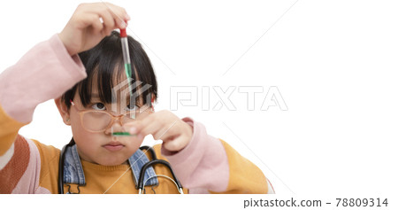 Education and science concept, Little Asian student girl making science experiment in the laboratory room and test science chemical with colorful liquid in beaker in laboratory room at to school. 78809314