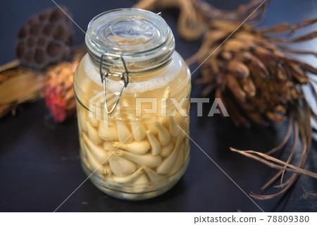 Pickled scallions in a bottle Pickled scallions in a bottle 78809380