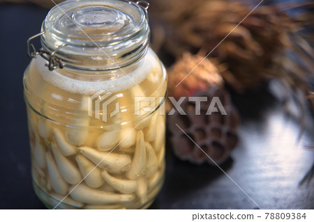 Pickled scallions in a bottle 78809384